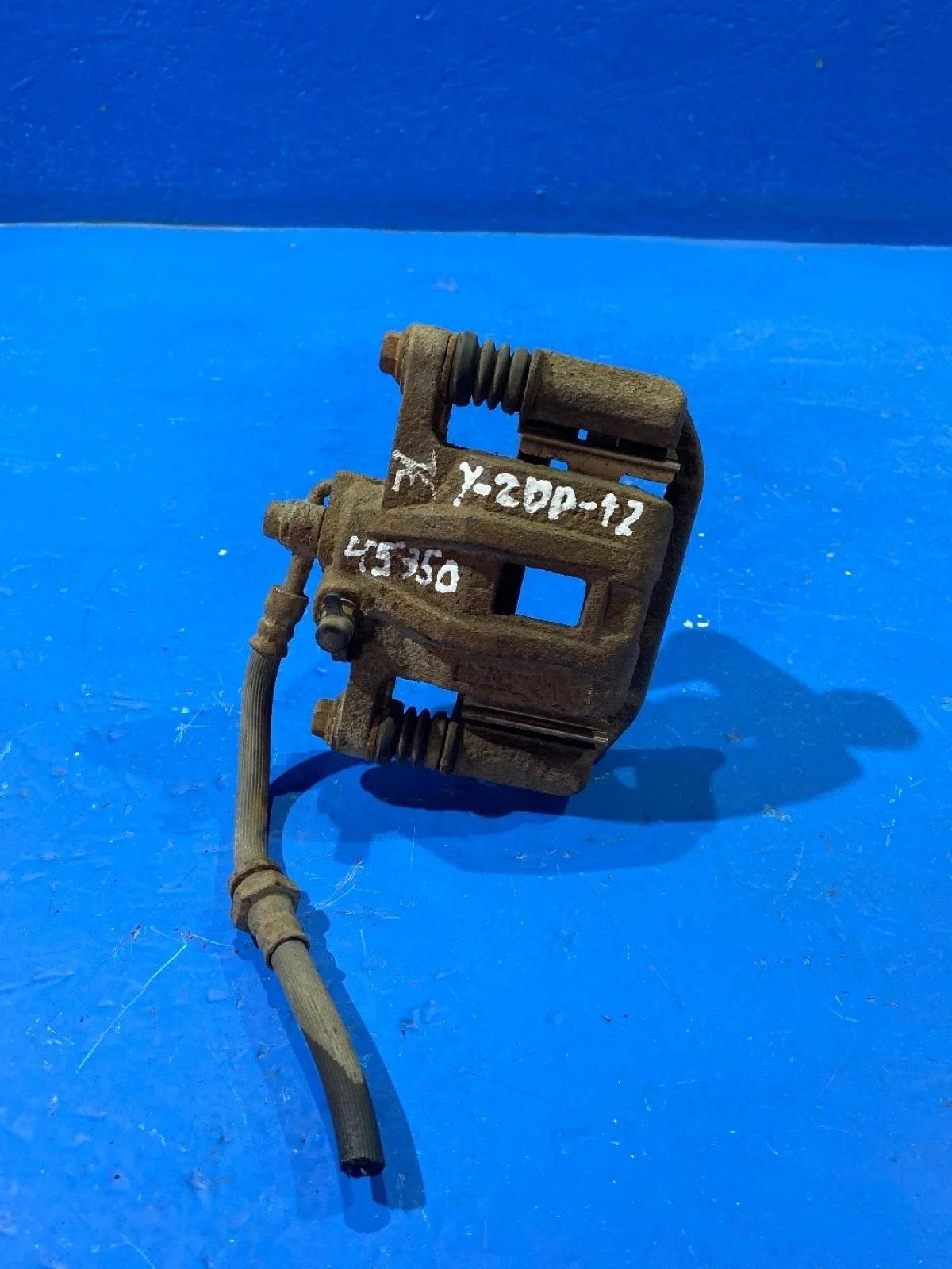 Суппорт тормозной задний левый Chevrolet Lacetti I (2004—2013)