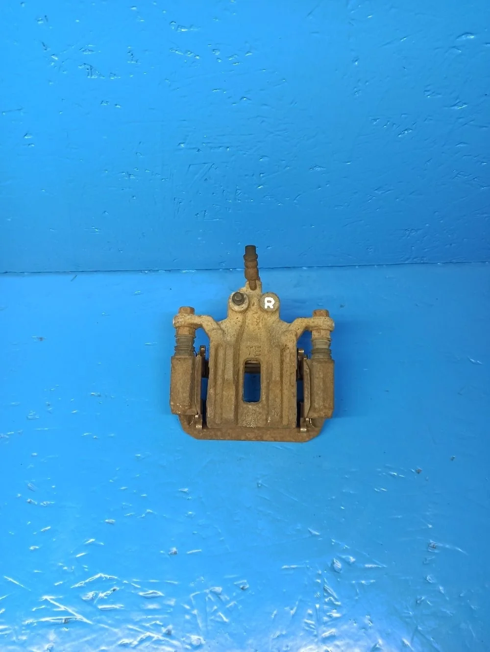 Суппорт тормозной задний правый Nissan Pathfinder III (2004—2010)