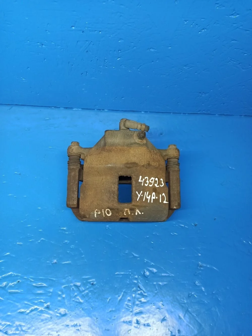 Суппорт тормозной передний левый Nissan Almera N16 рестайлинг (2002—2006)