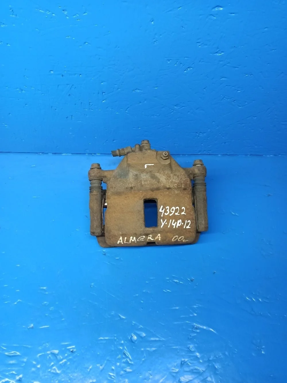 Суппорт тормозной передний левый Nissan Almera N16 рестайлинг (2002—2006)