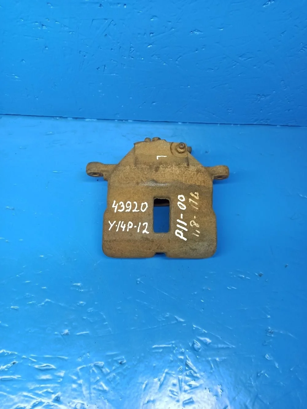 Суппорт тормозной передний левый Nissan Almera N16 рестайлинг (2002—2006)