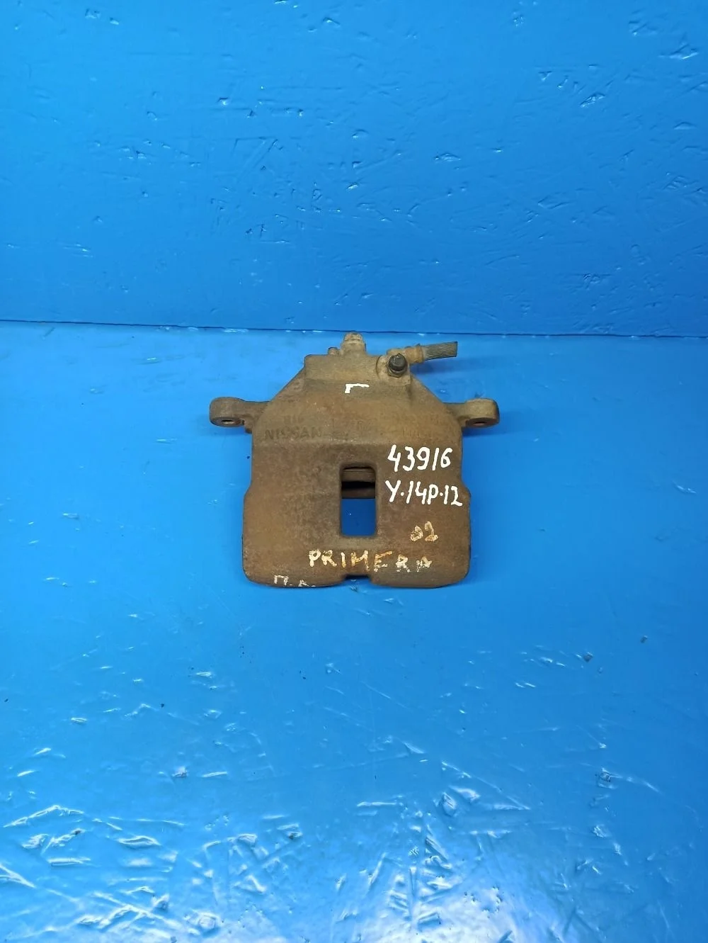 Суппорт тормозной передний левый Nissan Almera N16 рестайлинг (2002—2006)