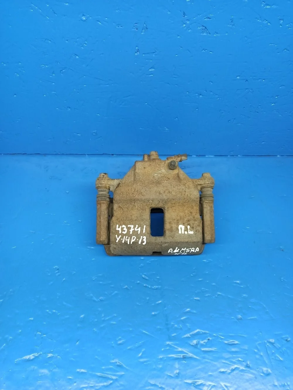 Суппорт тормозной передний левый Nissan Almera N16 рестайлинг (2002—2006)