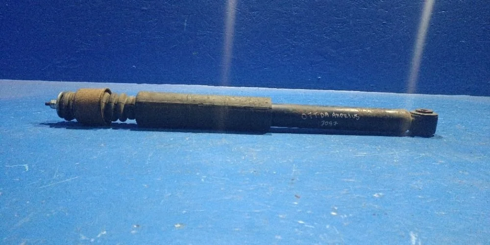 Амортизатор задний L=R Nissan Tiida C11 (2004—2012)