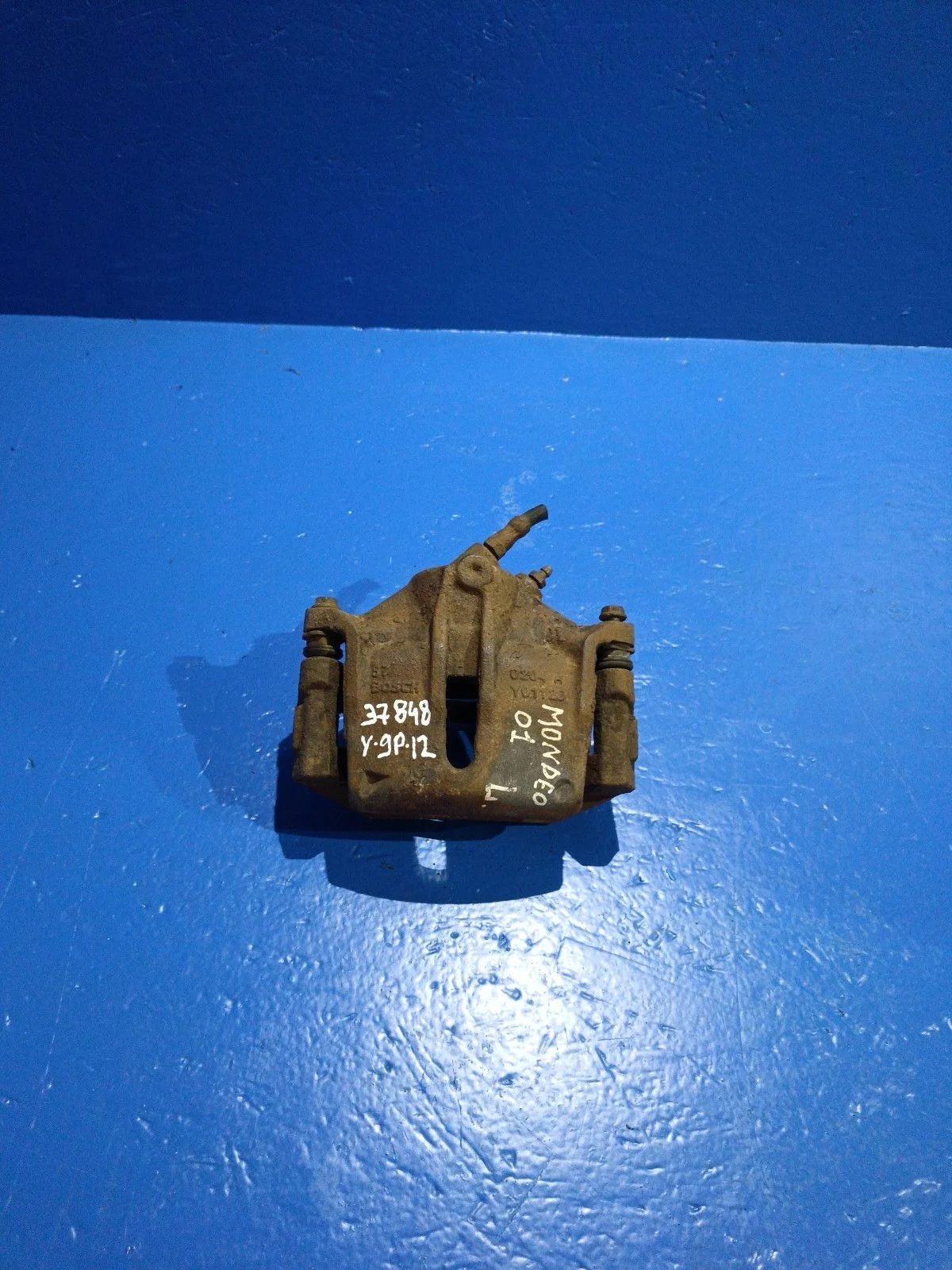 Суппорт тормозной передний левый Ford Mondeo III (2000—2003)