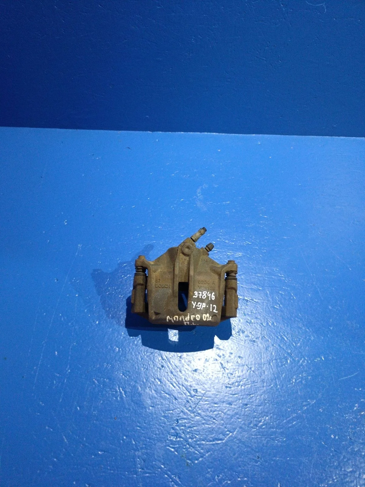 Суппорт тормозной передний левый Ford Mondeo III (2000—2003)