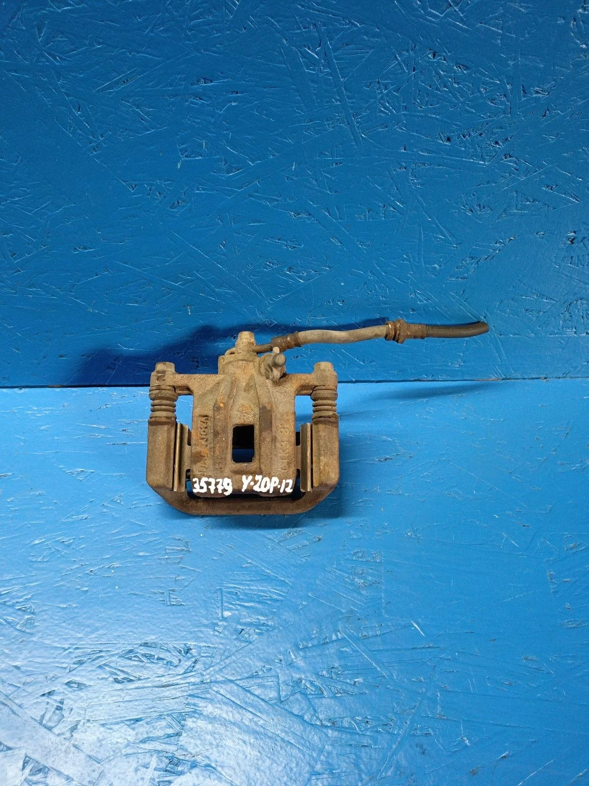 Суппорт тормозной задний правый Chevrolet Lacetti I (2004—2013)