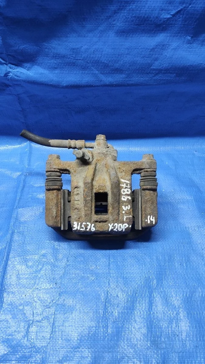 Суппорт тормозной задний левый Chevrolet Lacetti I (2004—2013)