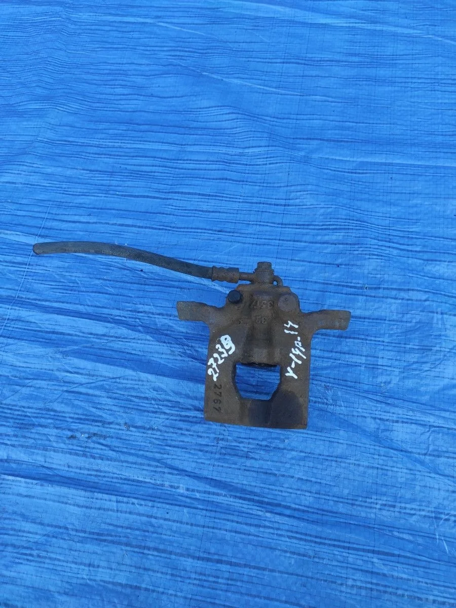 Суппорт тормозной задний левый Nissan Qashqai I (2006—2010)