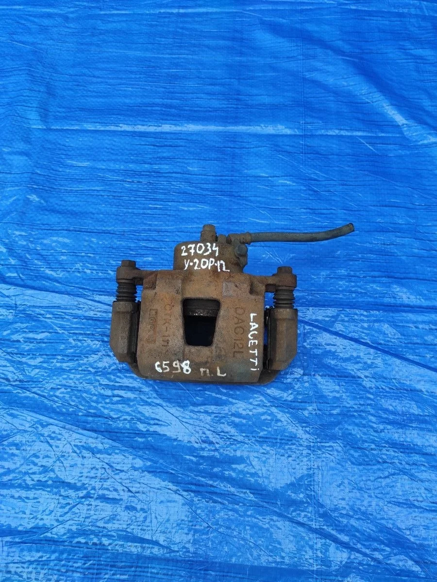 Суппорт тормозной передний левый Chevrolet Lacetti I (2004—2013)