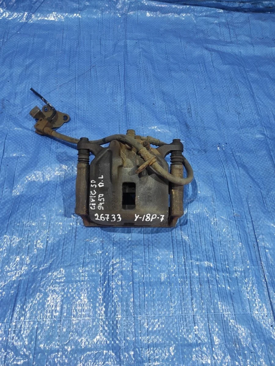 Суппорт тормозной передний левый Honda Civic 5D