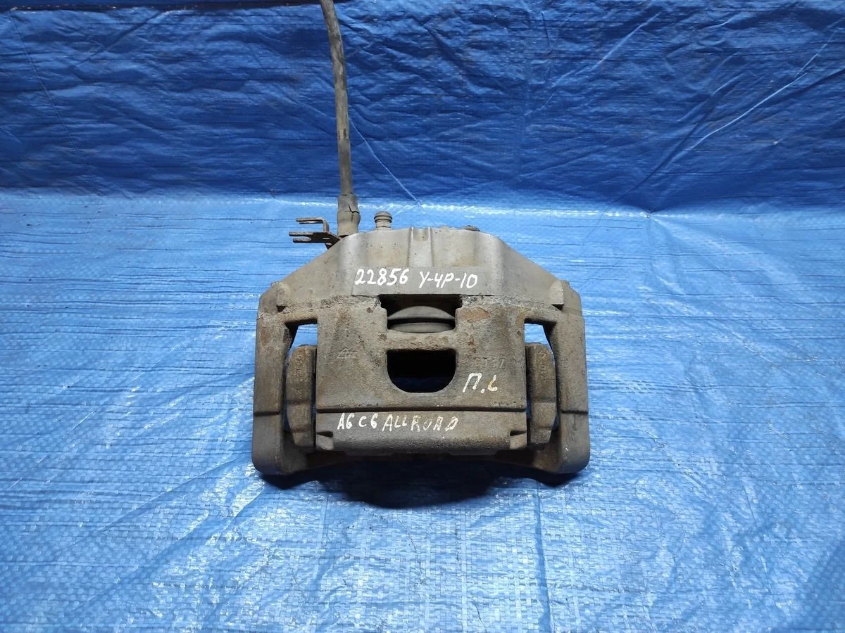 Суппорт тормозной передний левый Audi A6 Allroad Quattro C6 (2006—2008)