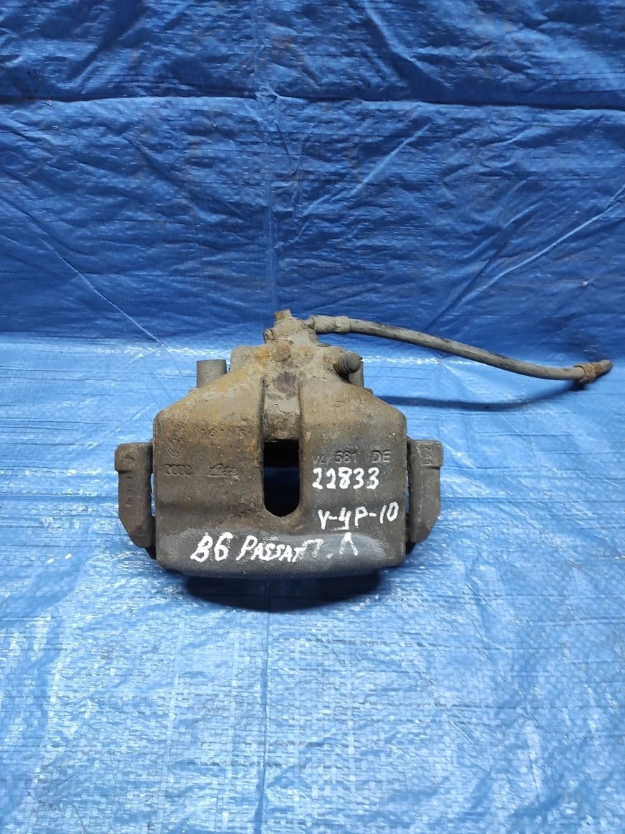 Суппорт тормозной передний левый Volkswagen Golf Mk5 (2003—2009)