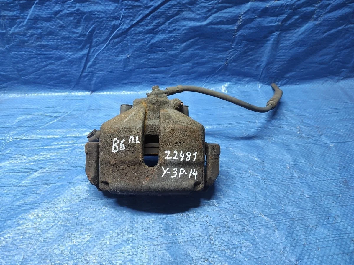 Суппорт тормозной передний левый Volkswagen Golf Mk5 (2003—2009)