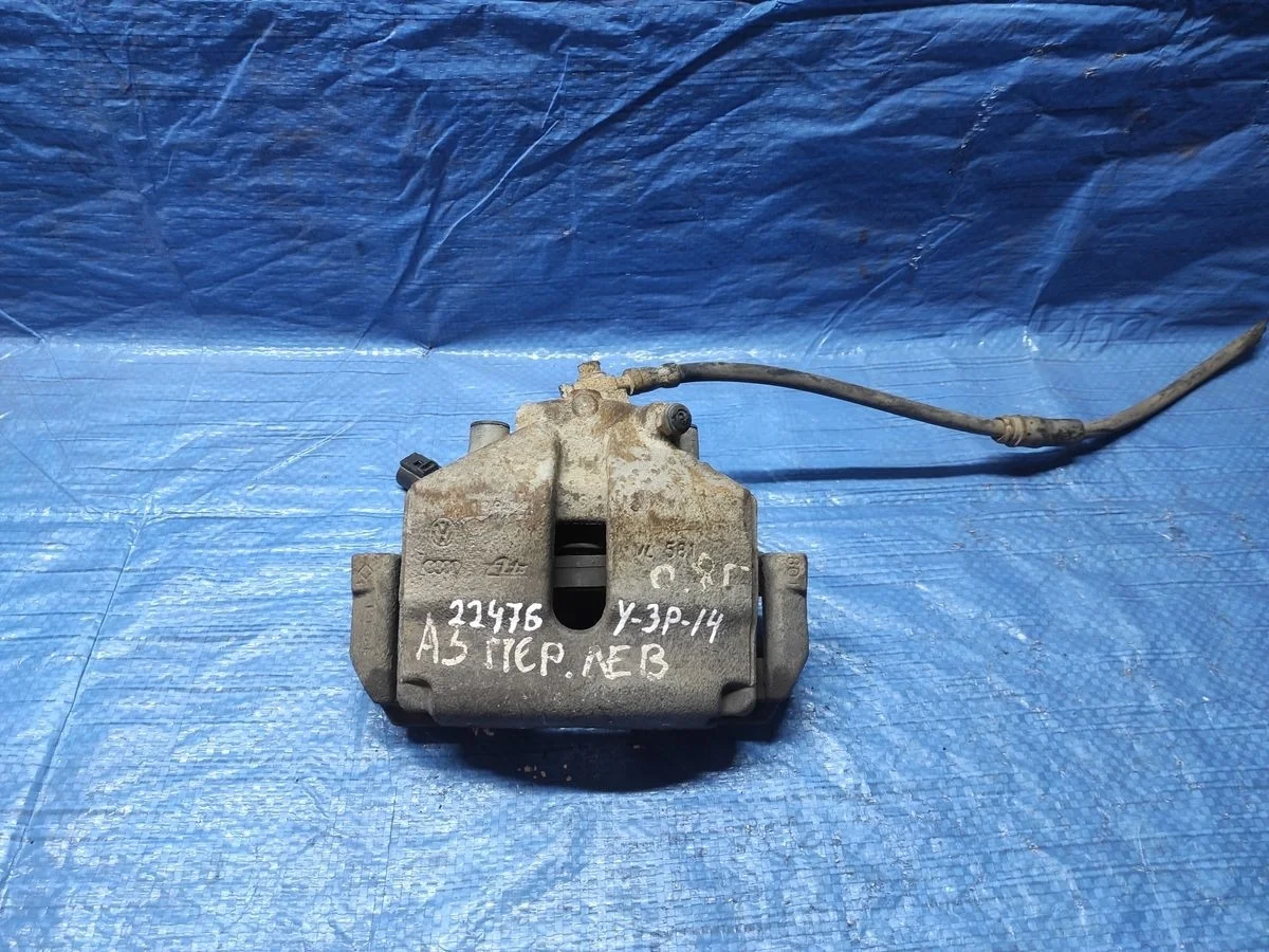 Суппорт тормозной передний левый Volkswagen Golf Mk5 (2003—2009)