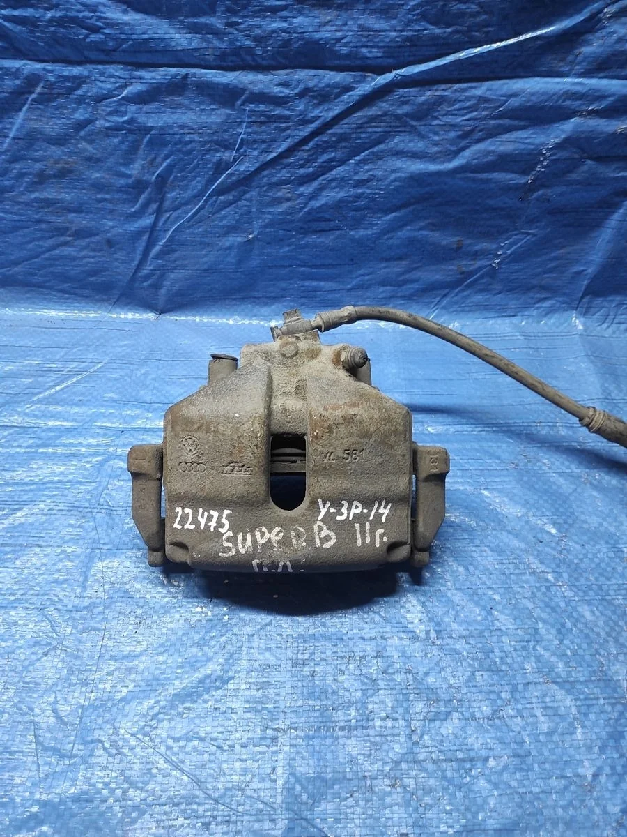 Суппорт тормозной передний левый Volkswagen Golf Mk5 (2003—2009)