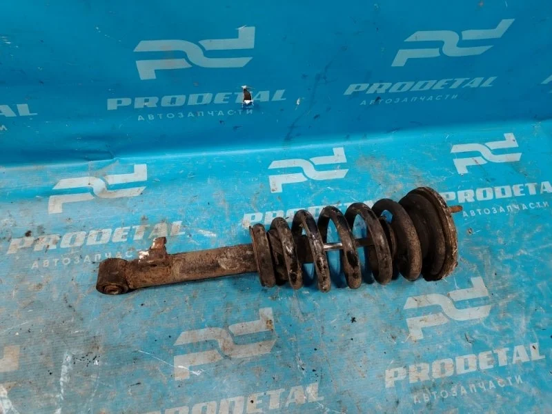 Амортизатор передний левый Mitsubishi L200