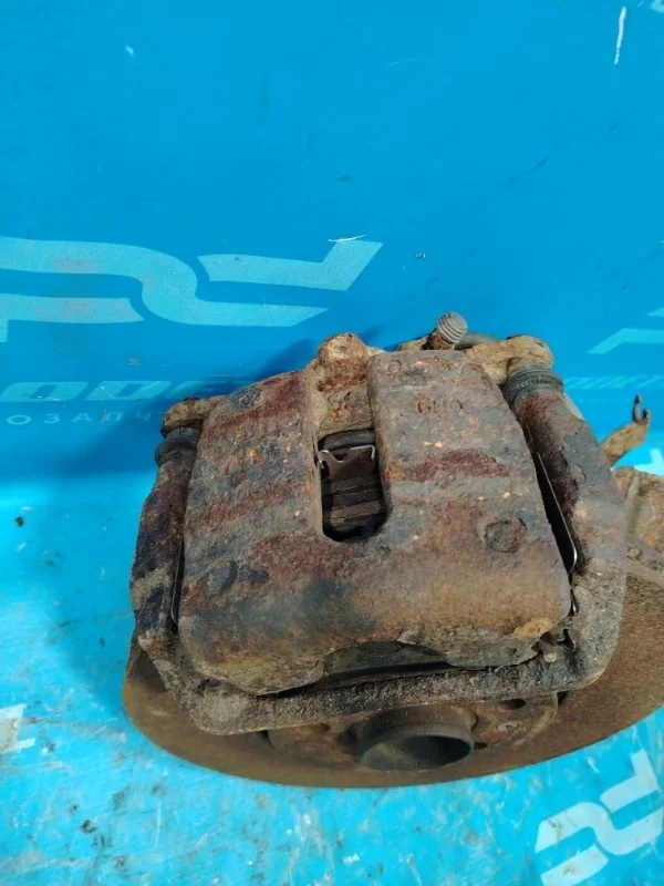 Суппорт тормозной передний левый Volkswagen Polo