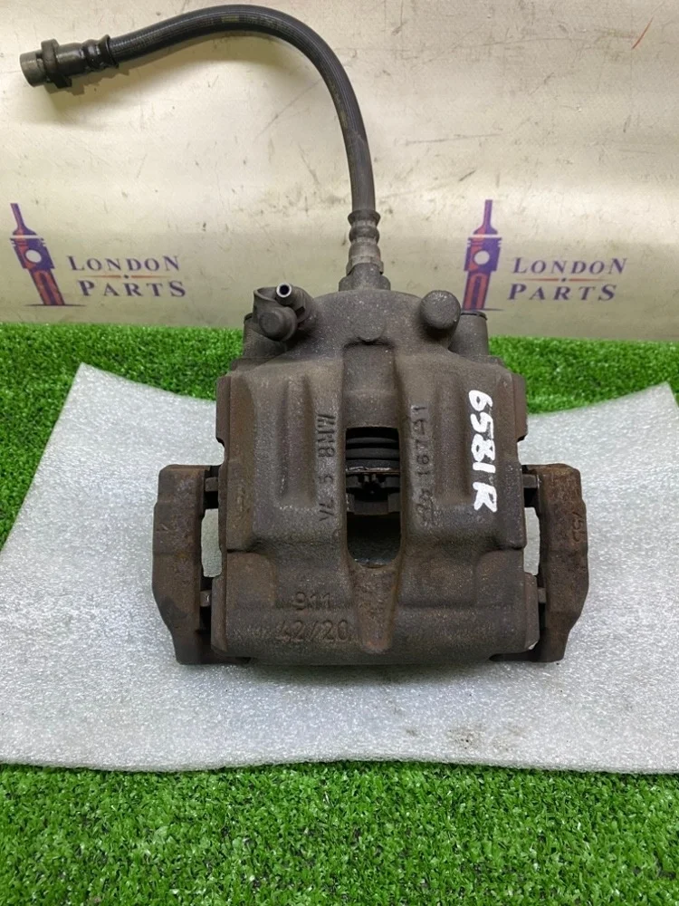 Суппорт тормозной BMW X1 20iX E84