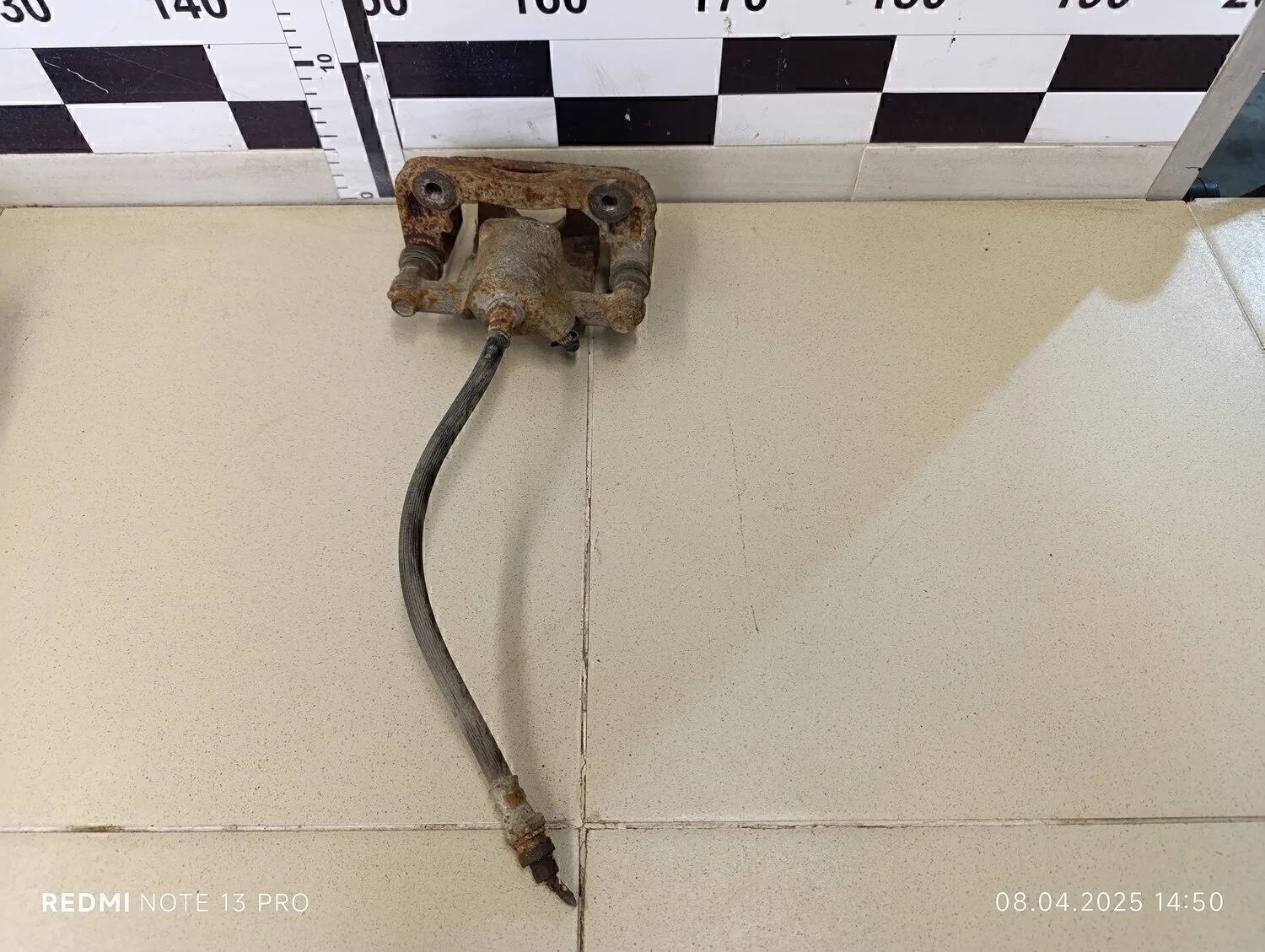 Суппорт задний левый Magentis 2000-2005