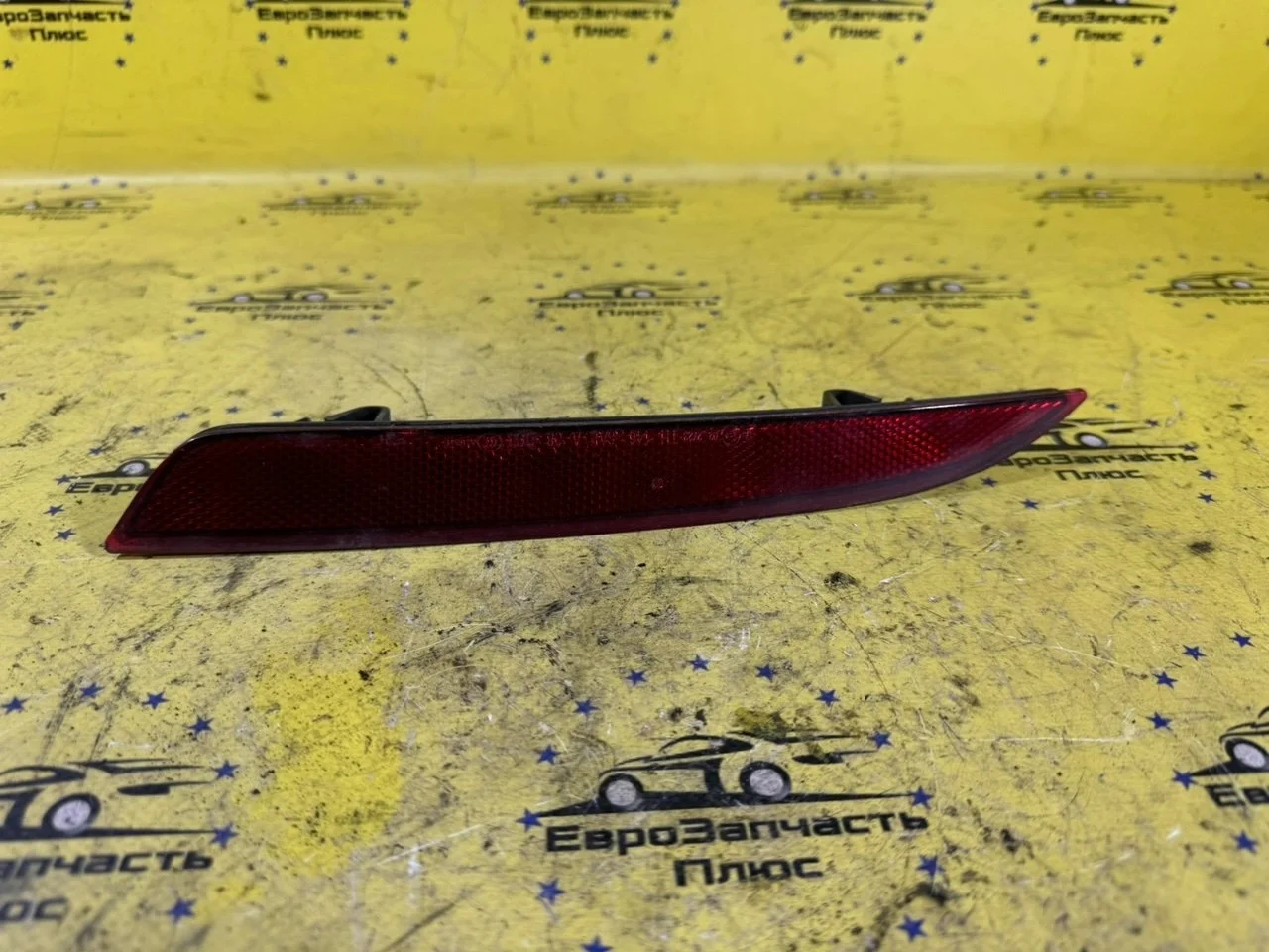 Отражатель бампера Opel Astra 13262017 J, задний левый