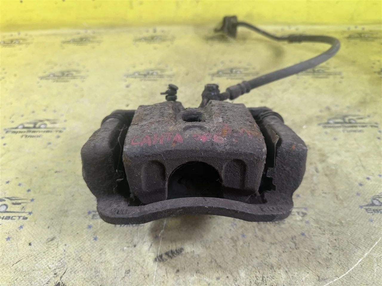 Суппорт тормозной Hyundai Santa Fe 2 582102P700 CM, задний левый