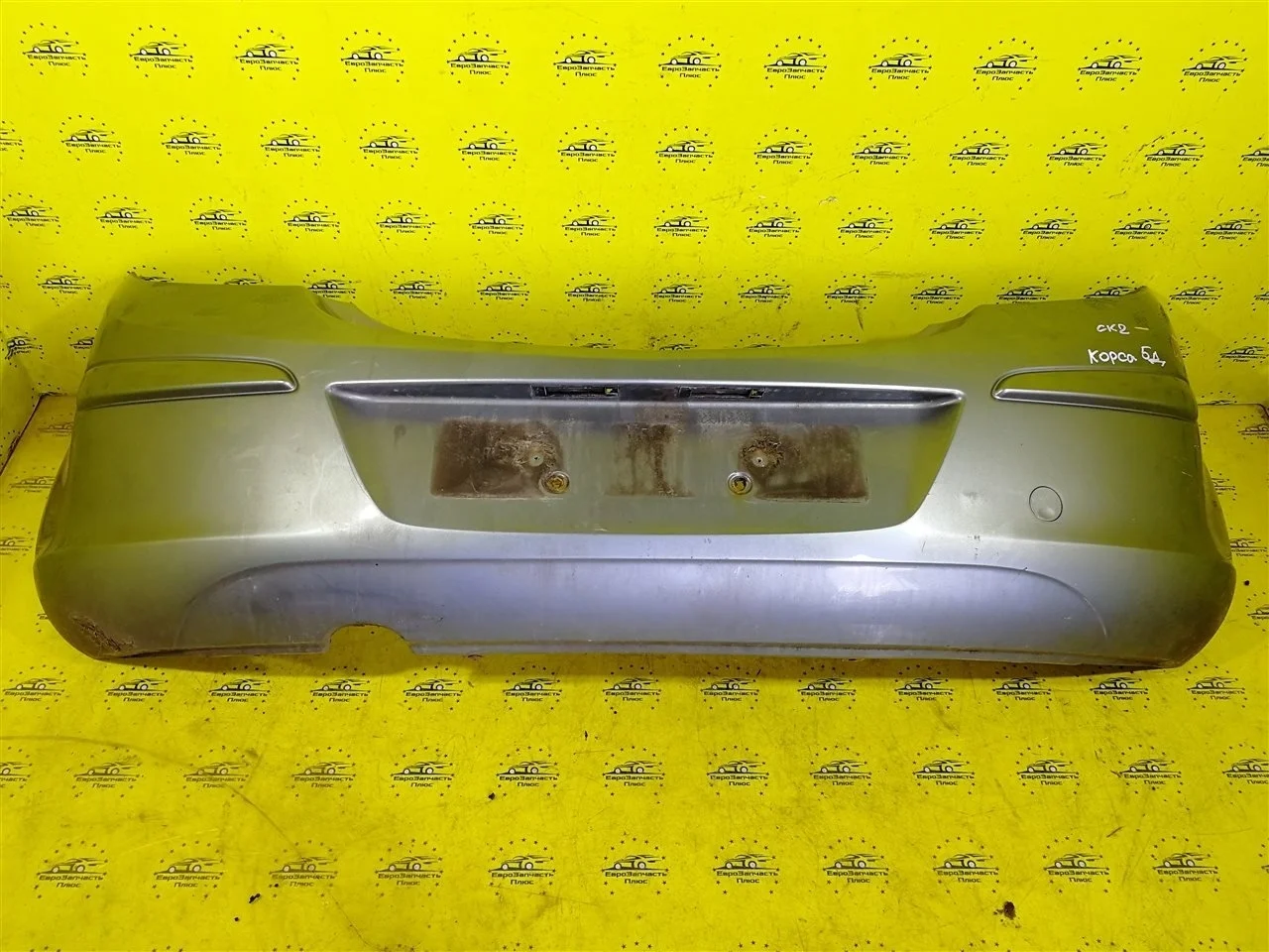 Бампер Opel Corsa 13179916 D, задний