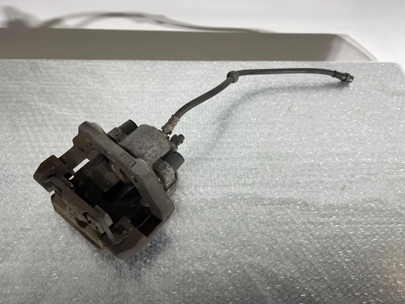 Суппорт тормозной BMW X5 2011 34216776787 E70 N55B30, задний левый