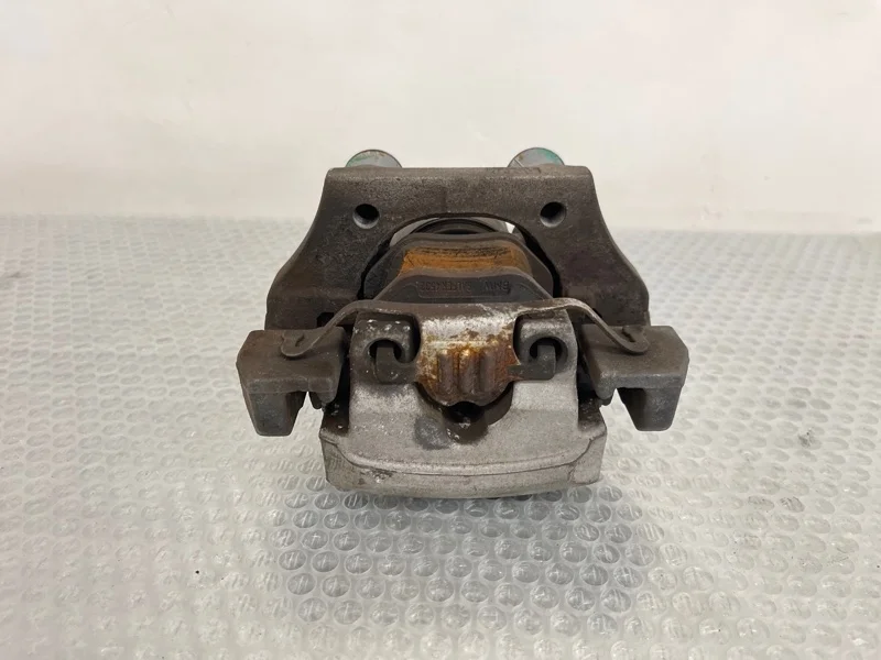 Суппорт тормозной BMW X5 2010 34216776787 E70 N55B30, задний левый