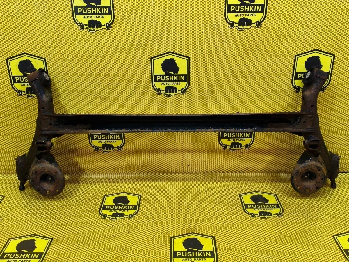 Балка подвески KIA Rio 2012 551004L100 QB G4FA, задняя