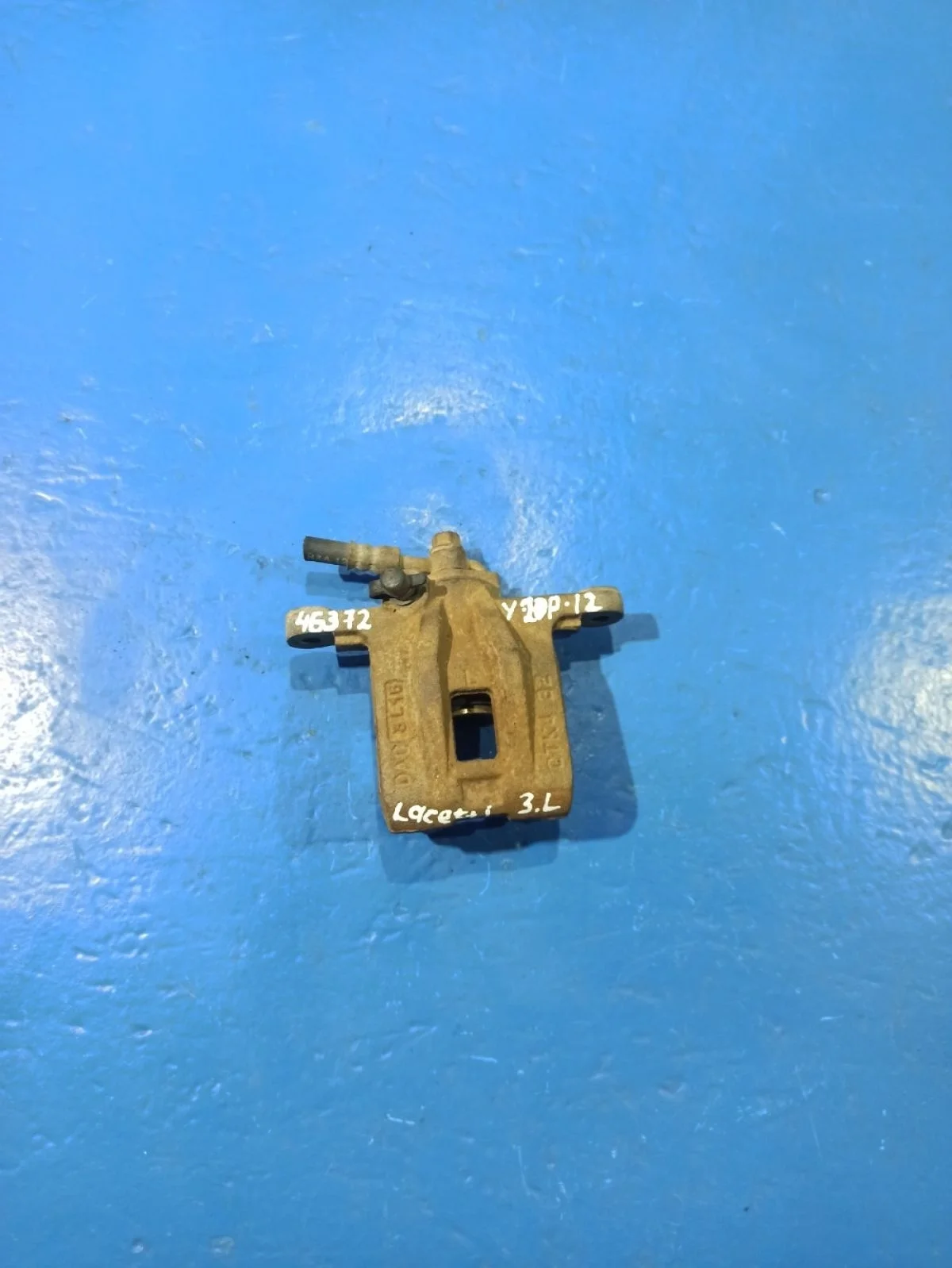 Суппорт тормозной задний левый Chevrolet Lacetti I (2004—2013)