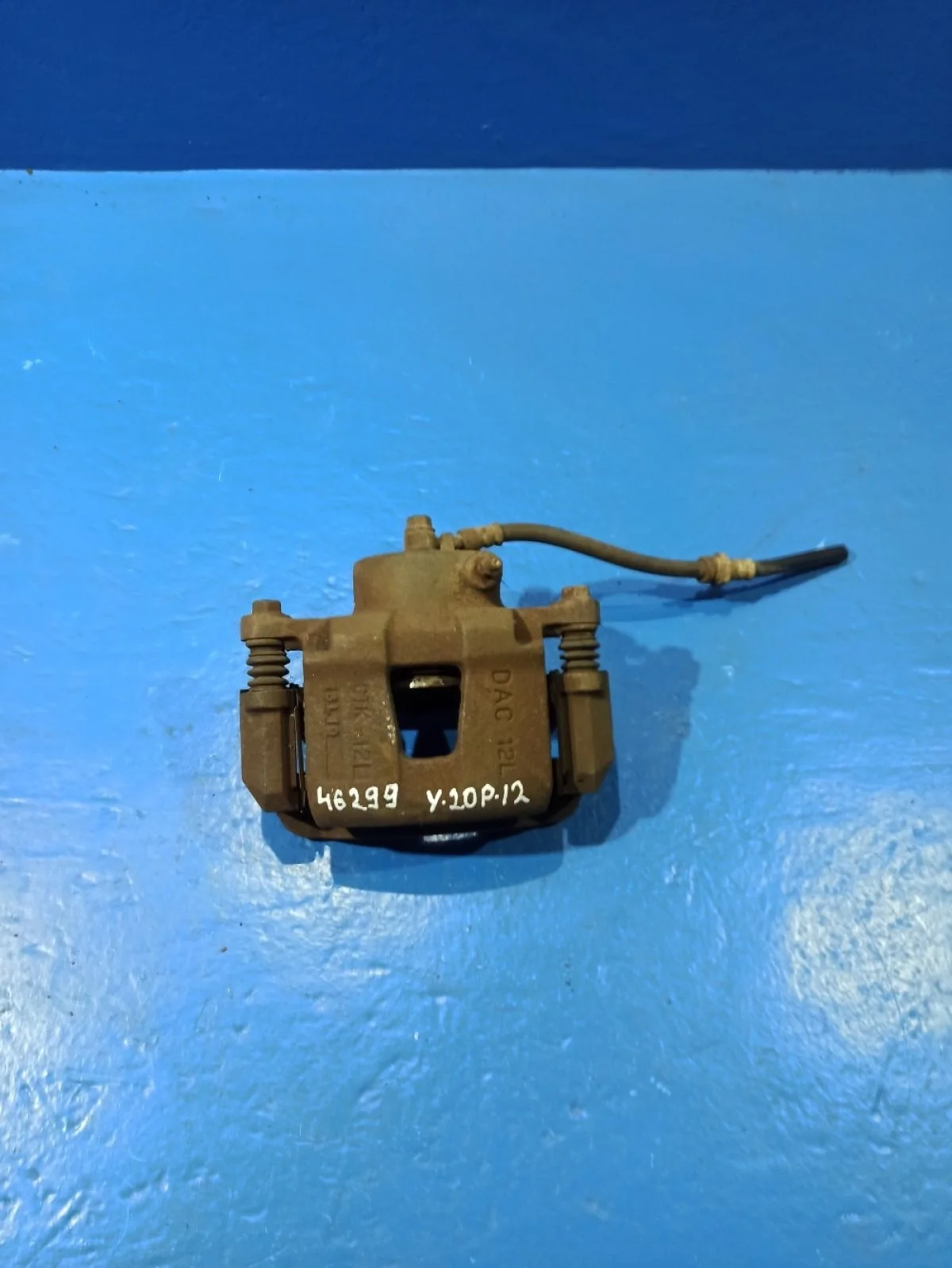 Суппорт тормозной передний левый Chevrolet Lacetti I (2004—2013)