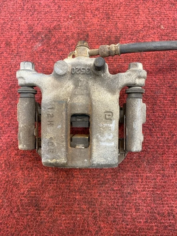 Тормозной суппорт Nissan X-Trail 44001JG00A T31, задний правый