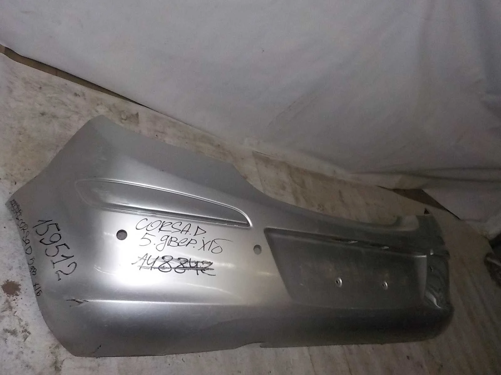 Бампер Opel Corsa D (2006—2010) Зад