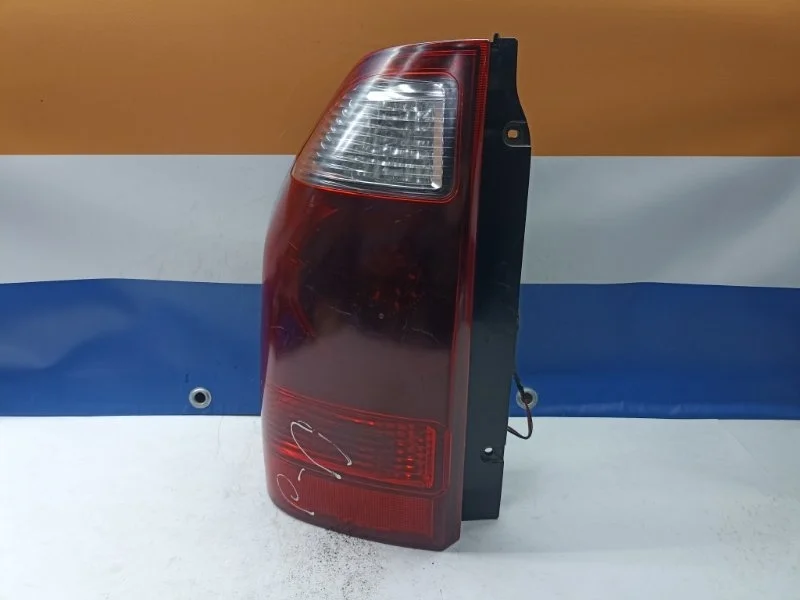 Фонарь Mitsubishi Pajero 2006 MN133765 V78W 4M41, задний левый