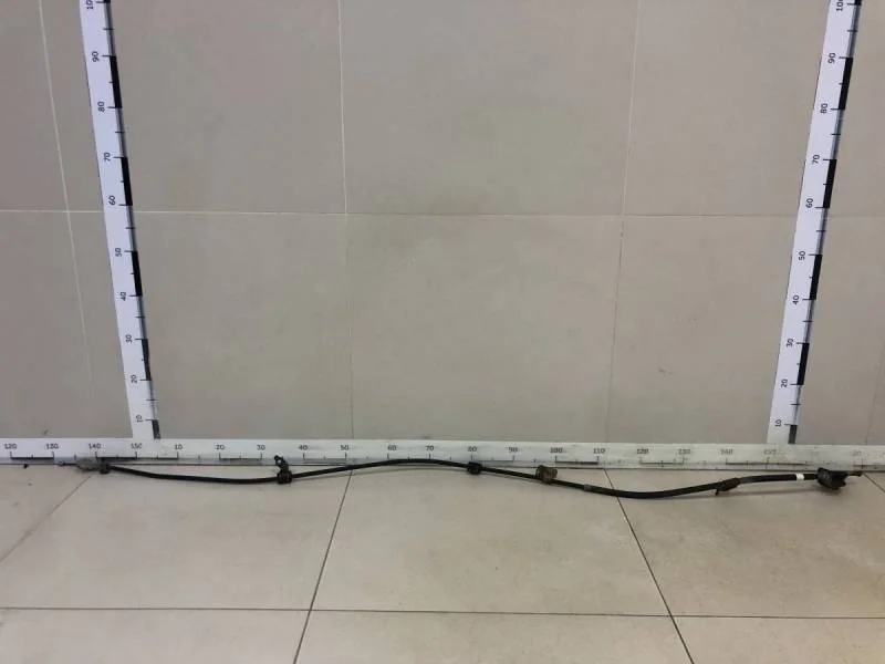 Трос стояночного тормоза левый Toyota Auris (E150) 2006-2012