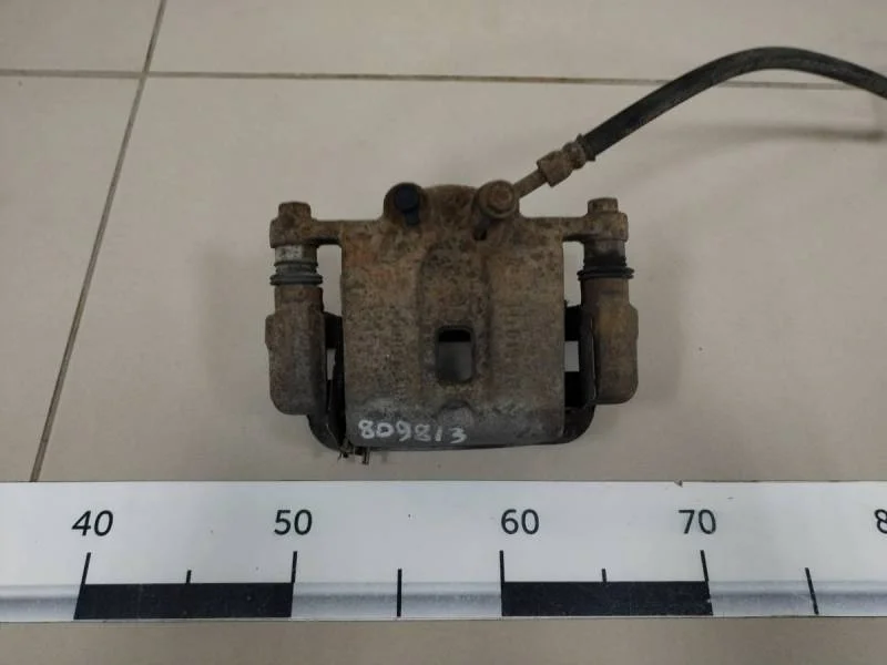 Суппорт задний левый Kia Sorento (XM) 2009>