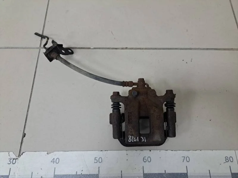 Суппорт задний левый Nissan X-Trail (T31) 2007-2014