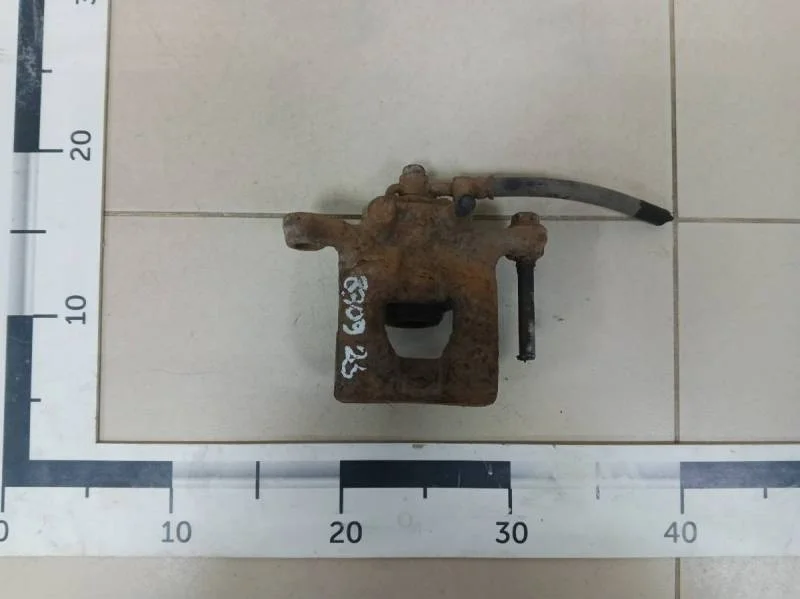 Суппорт задний правый Nissan Tiida (C11) 2007-2014