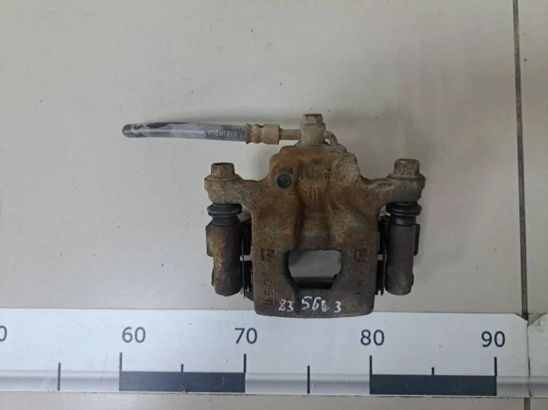 Суппорт задний левый Nissan Tiida (C11) 2007-2014