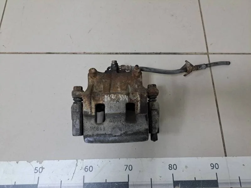 Суппорт передний левый Mazda CX-7 (ER) 2006-2012