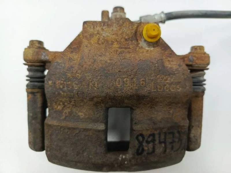 Суппорт передний левый Nissan Almera (N16) 2000-2006