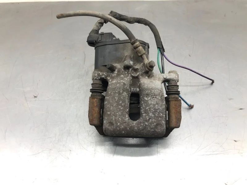 Суппорт тормозной Volvo V60 2015 36001375 УНИВЕРСАЛ D4162T, задний левый