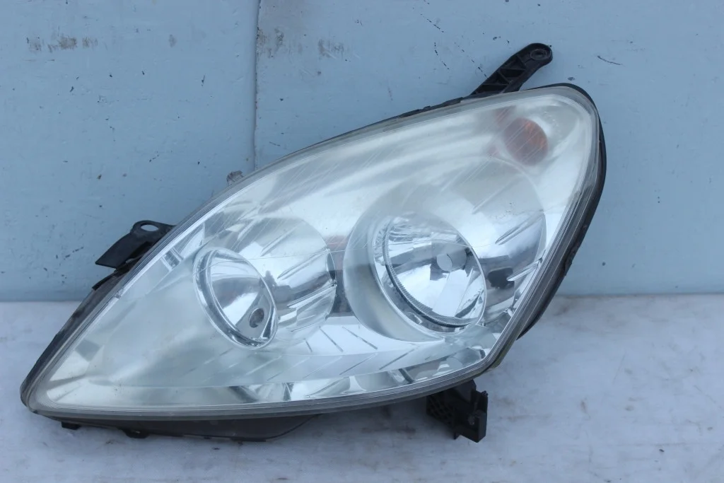 Фара хромированная левая Opel Zafira B ZbФР47