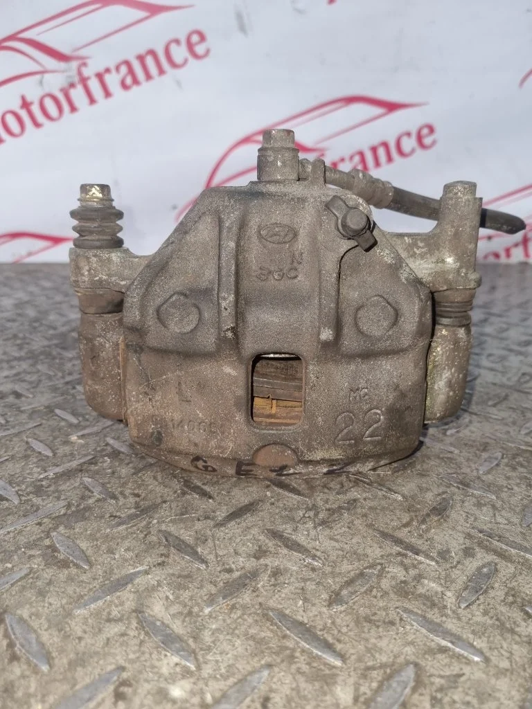 Суппорт тормозной Hyundai Getz 581101C100, передний левый