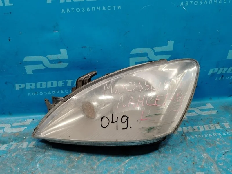 Фара левая Mitsubishi Lancer CS 2000