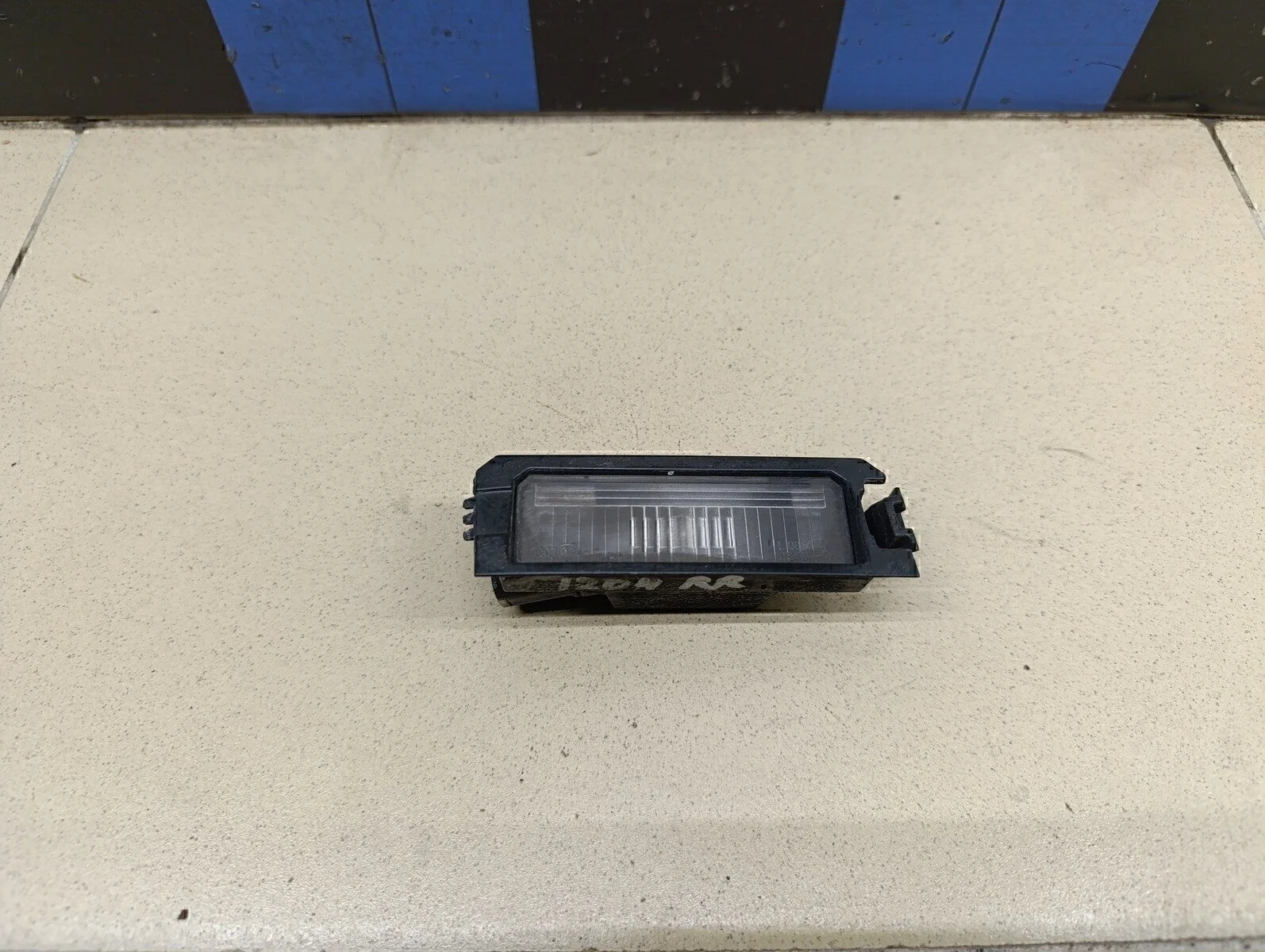 Фонарь подсветки номера RIO 2017>