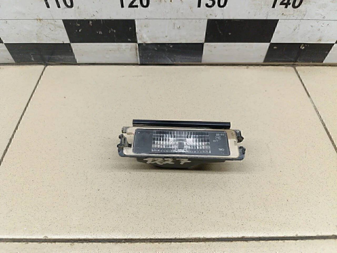 Фонарь подсветки номера Logan 2005-2014