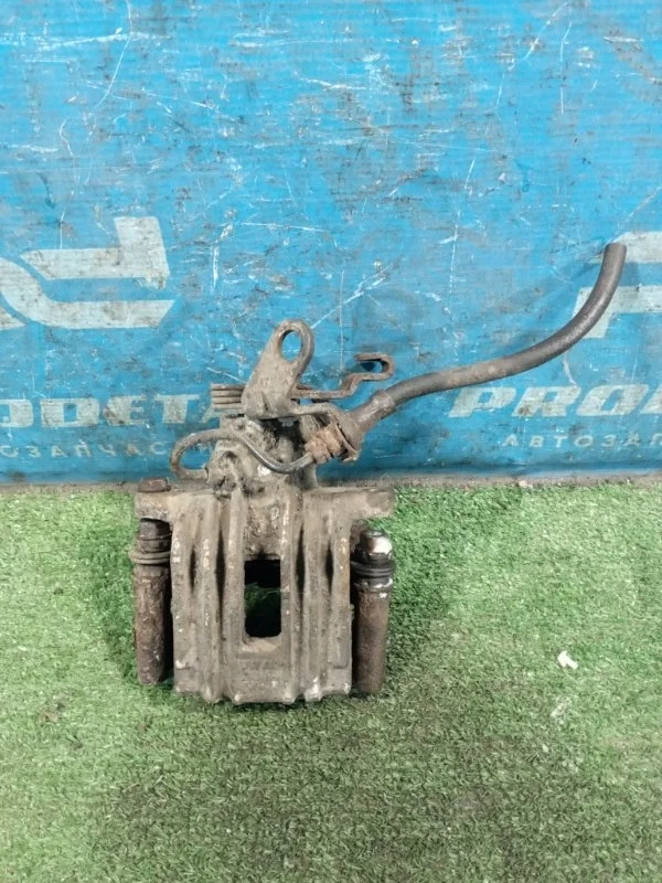 Суппорт тормозной задний левый Volkswagen Golf