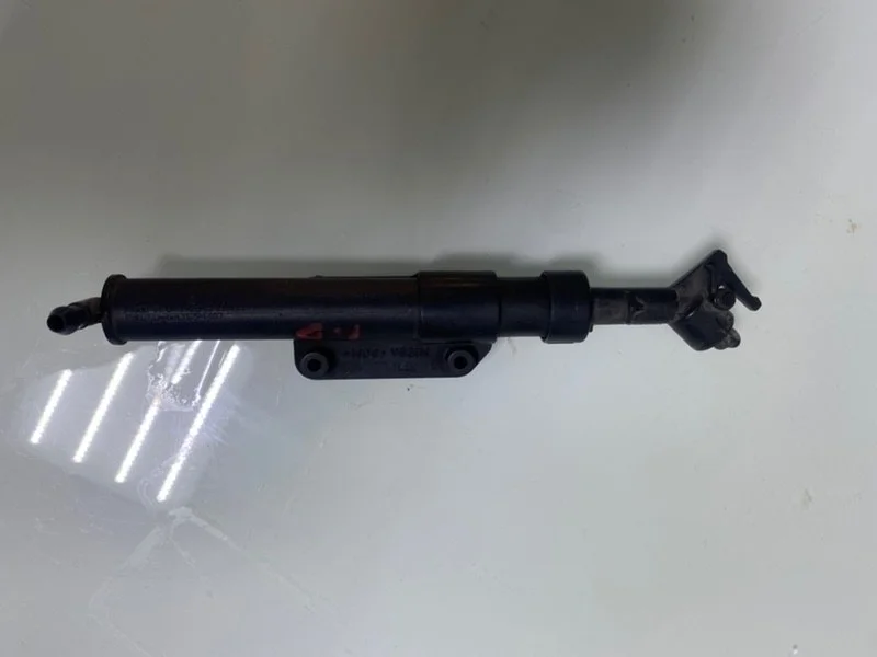 Форсунка омывателя фары Volvo 31294407, правая